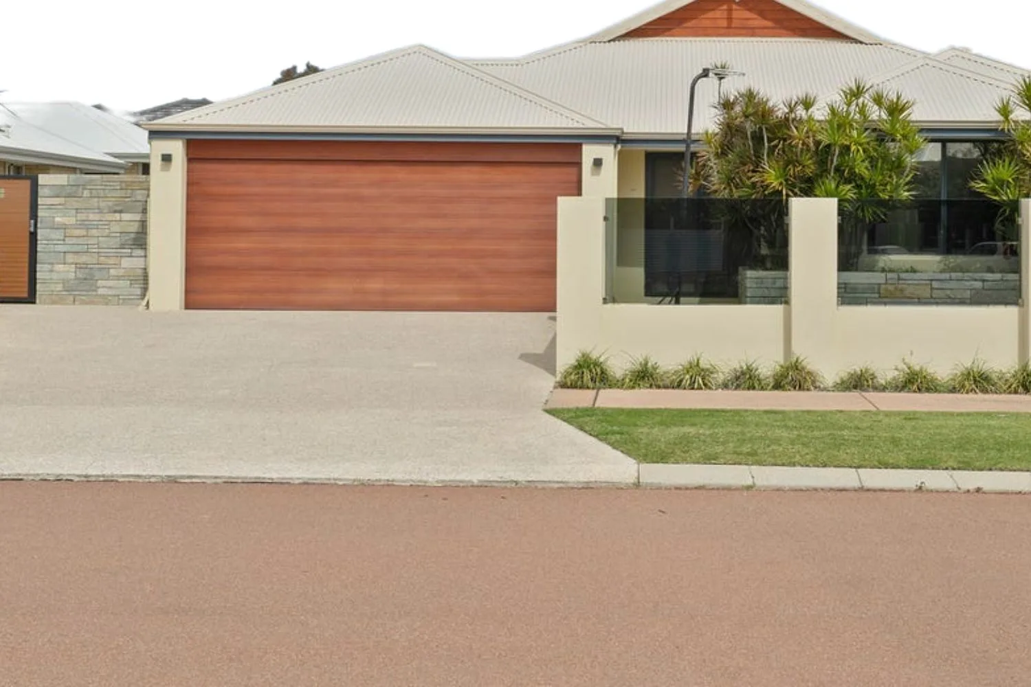 Concrete crossover and driveway finished for a Sunshine Coast property