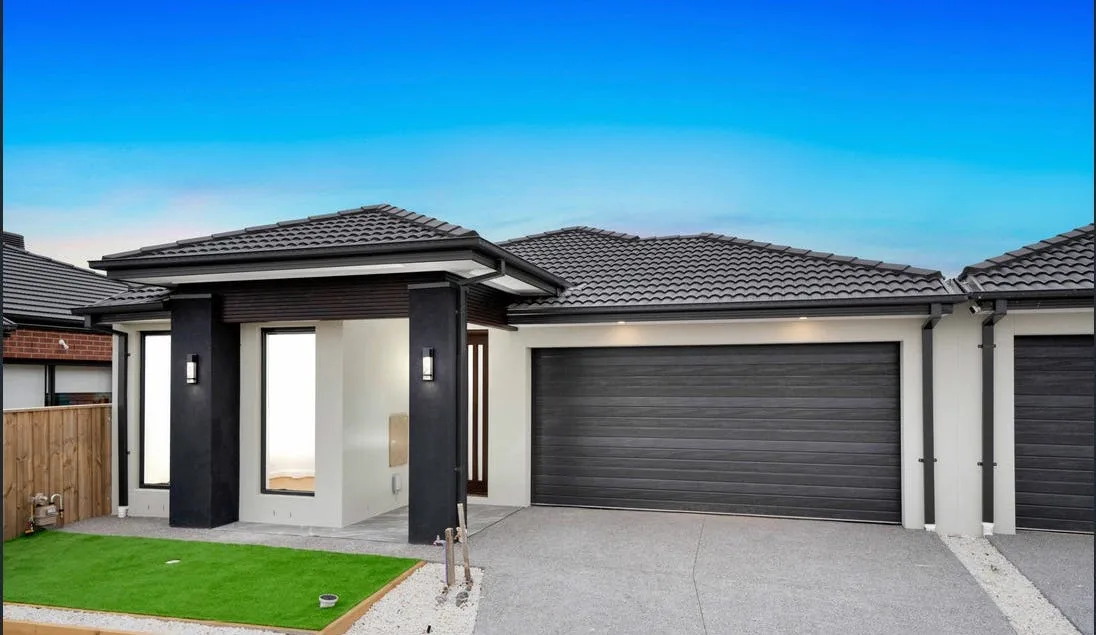 New concrete driveway leading to a Sunshine Coast home