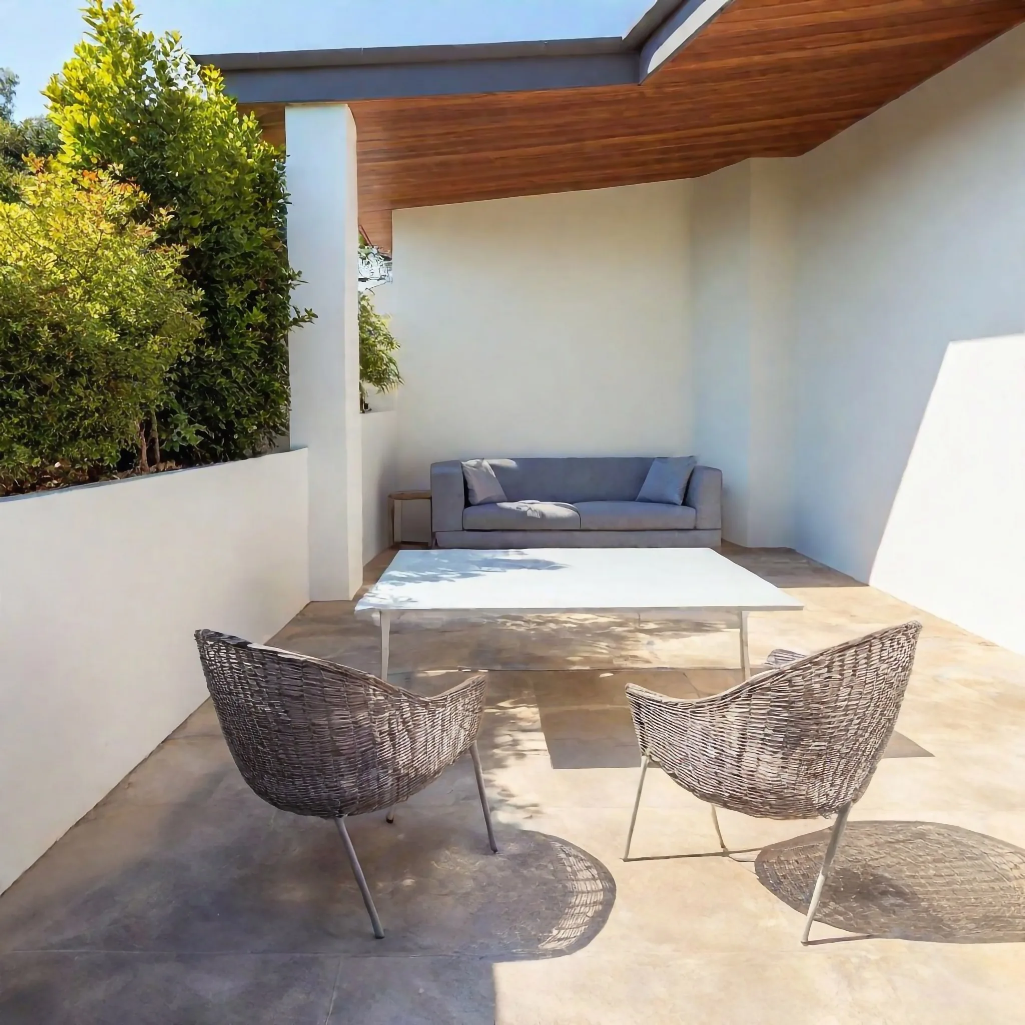 Durable concrete patio surface with drainage and expansion joints