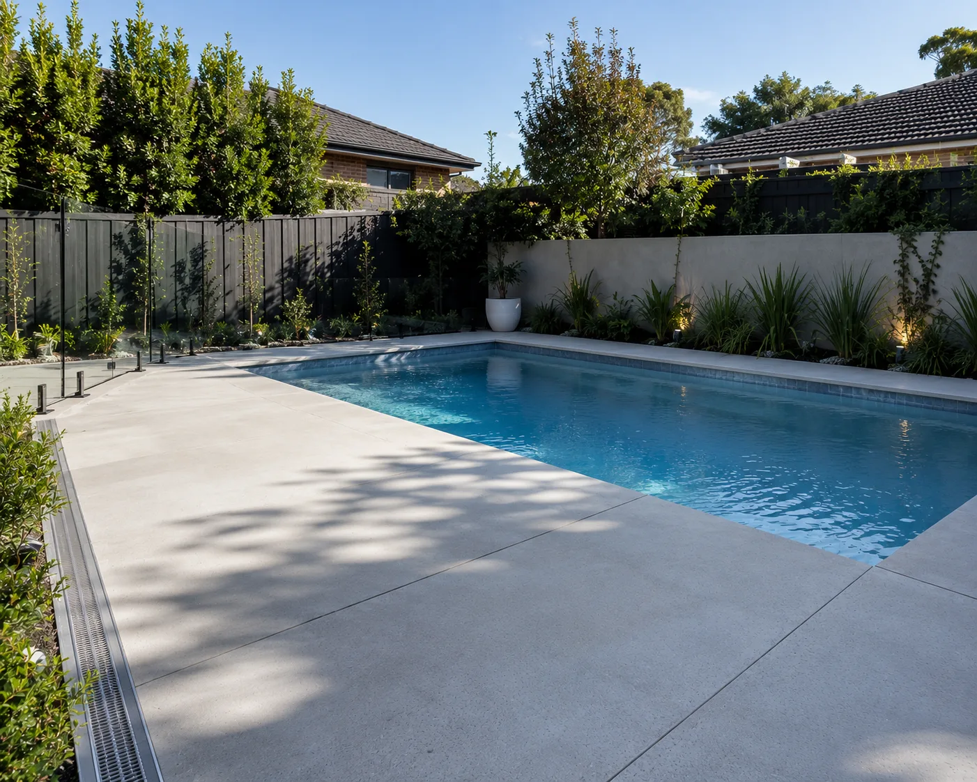 Non-slip concrete pool surround finished around an in-ground pool