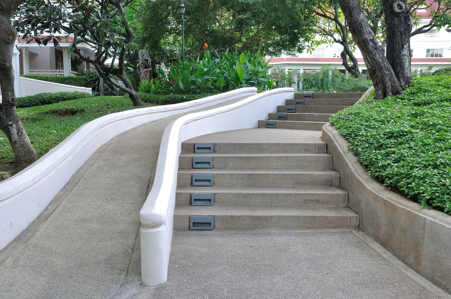 Concrete ramp providing durable, safe access on a sloped site